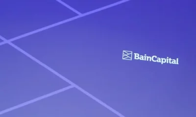 Bain Capital logo on blue geometric background