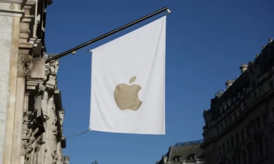 White flag with Apple logo on building