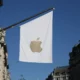 White flag with Apple logo on building