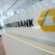 Commerzbank building interior with logo and woman walking.