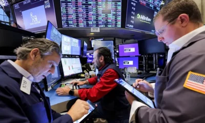 Stock traders working at New York Stock Exchange