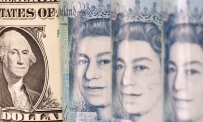 Close-up of US dollar and UK pound notes.