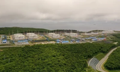 Aerial view of oil storage tanks and buildings.