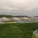 Aerial view of oil storage tanks and buildings.