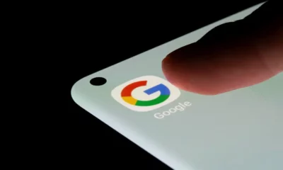 Finger tapping Google app on a smartphone.