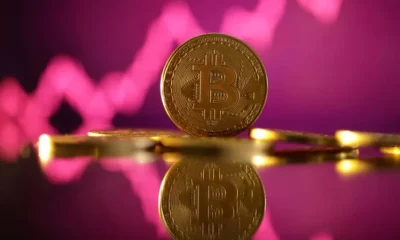 Bitcoin cryptocurrency with pink graph background