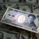 Japanese yen and US dollar banknotes on display