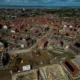 Aerial view of houses under construction in a neighbourhood.