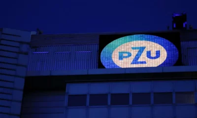 PZU logo on building at night.