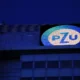 PZU logo on building at night.