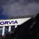 Forvia building with cloudy sky background.