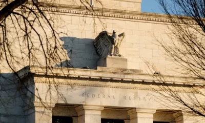 Federal Reserve building facade with eagle sculpture.