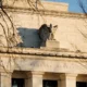 Federal Reserve building facade with eagle sculpture.