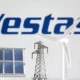 Vestas logo with solar panel and wind turbine.