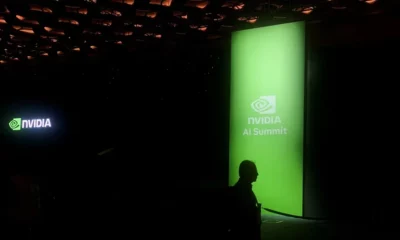 NVIDIA AI Summit event banner glowing in dark room.