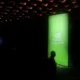 NVIDIA AI Summit event banner glowing in dark room.