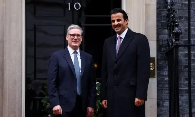 Two men standing outside Number 10 Downing Street.