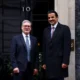 Two men standing outside Number 10 Downing Street.