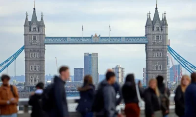 Tower Bridge with people walking in foreground.