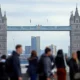 Tower Bridge with people walking in foreground.