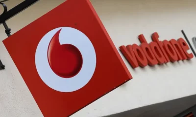 Vodafone store sign on building exterior.