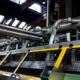 Industrial machinery with large metal pipes inside factory