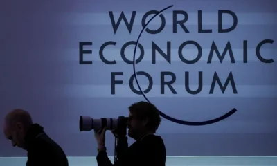 World Economic Forum photographer silhouette