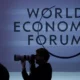 World Economic Forum photographer silhouette