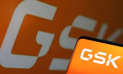 GSK logo displayed on screen and background.