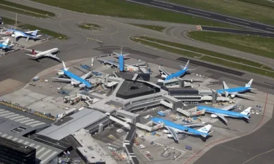 Aerial view of busy airport with parked planes.