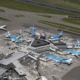 Aerial view of busy airport with parked planes.