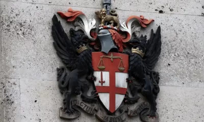 City of London coat of arms on wall.