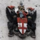 City of London coat of arms on wall.