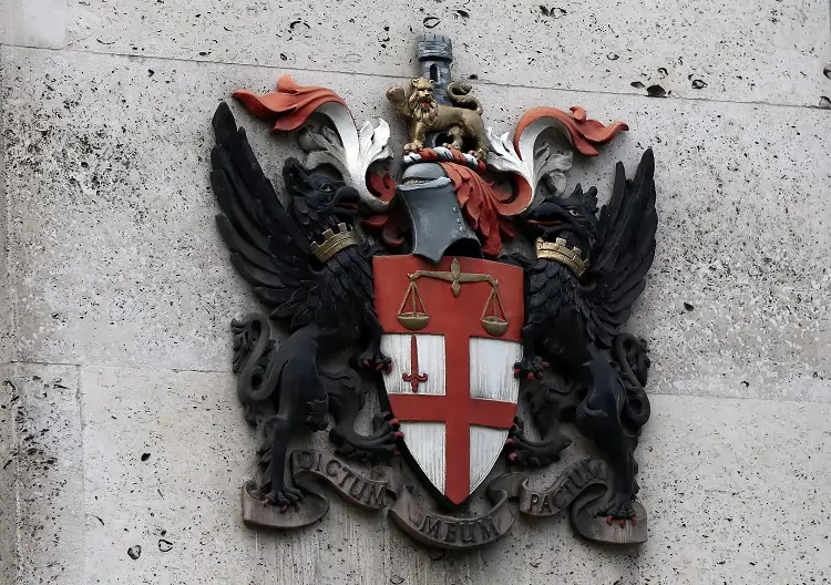 City of London coat of arms on wall.