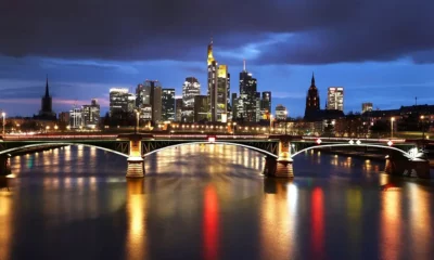 Frankfurt skyline at night with illuminated bridge