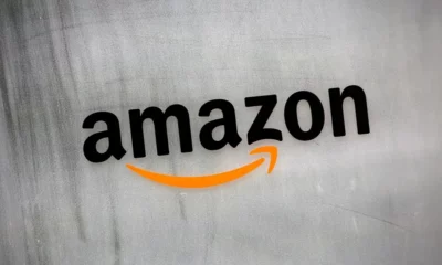 Amazon logo on textured wall background.