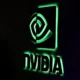 Illuminated Nvidia logo on dark background