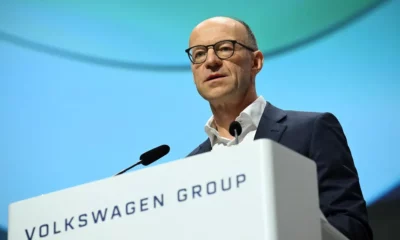 Person speaking at Volkswagen Group event.