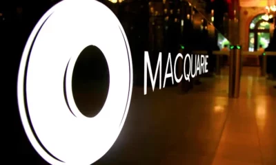 Macquarie logo on glass wall in a building.