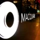 Macquarie logo on glass wall in a building.