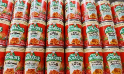 Chef Boyardee canned pasta on supermarket shelves.