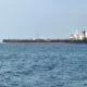 Large oil tanker sailing on open sea.