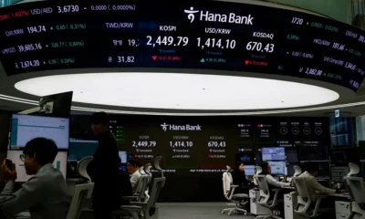 Hana Bank trading floor with digital stock displays.