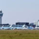 Schiphol Airport control tower and parked airplanes