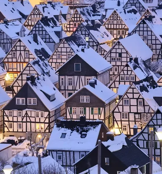 Snow-covered German village with half-timbered houses