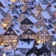 Snow-covered German village with half-timbered houses