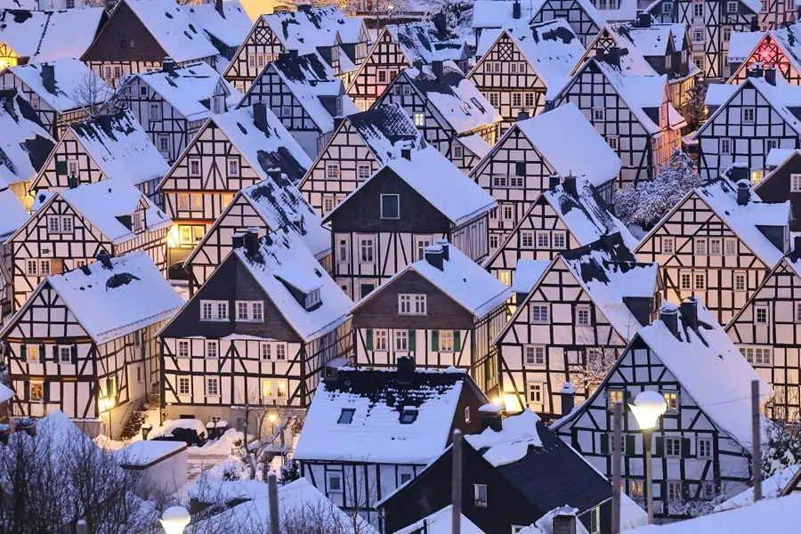 Snow-covered German village with half-timbered houses