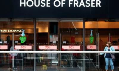 House of Fraser storefront with sale banners displayed.