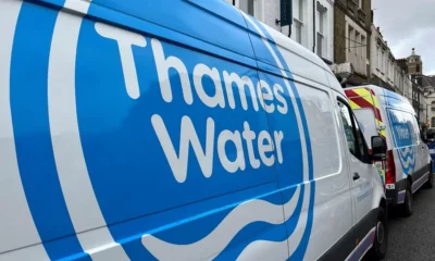 Thames Water vans parked on a London street.