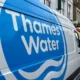 Thames Water vans parked on a London street.